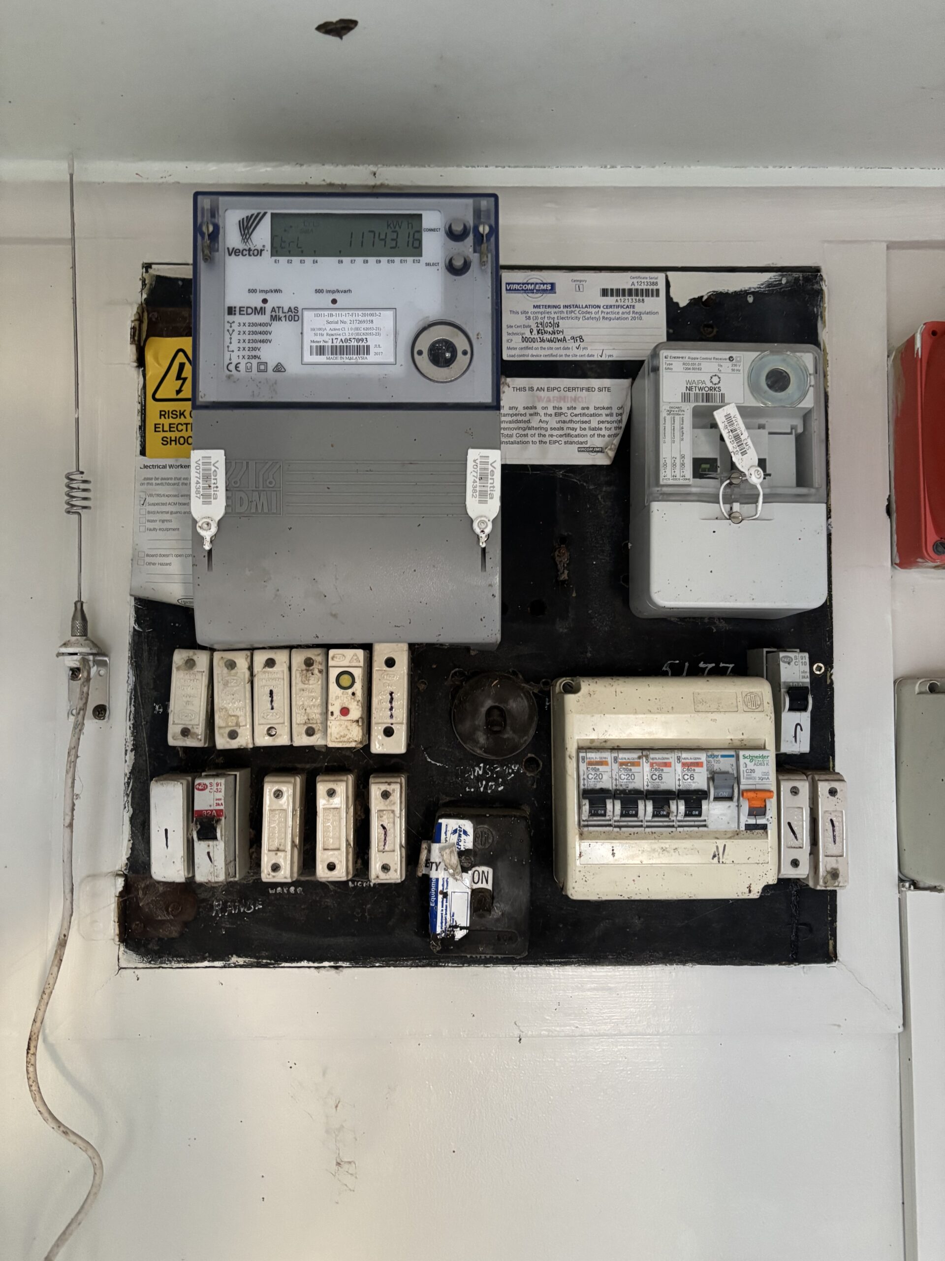 Old switchboard with porcelain fuses